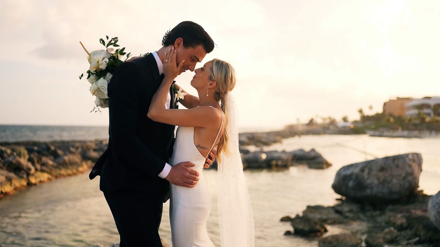 Couple embracing at sunset on the coast