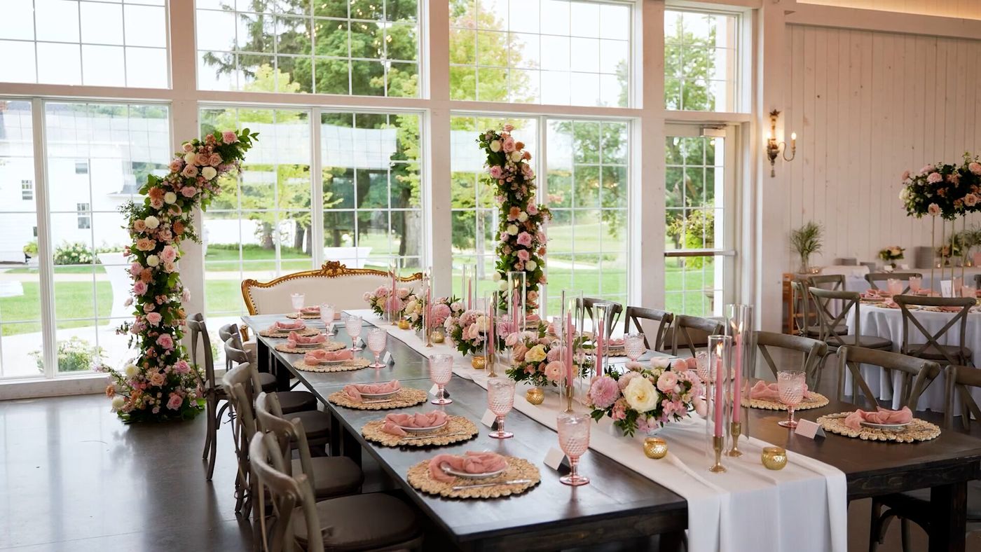 Head table styled with flowers and candles